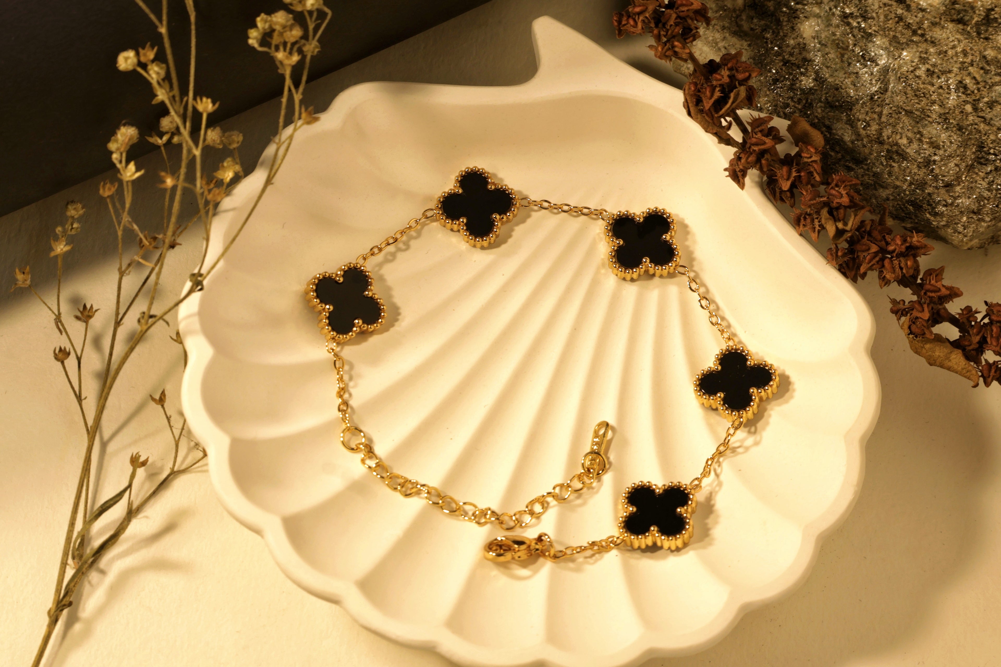 Noir Bloom Bracelet - gold chain with small black flower-shaped charms