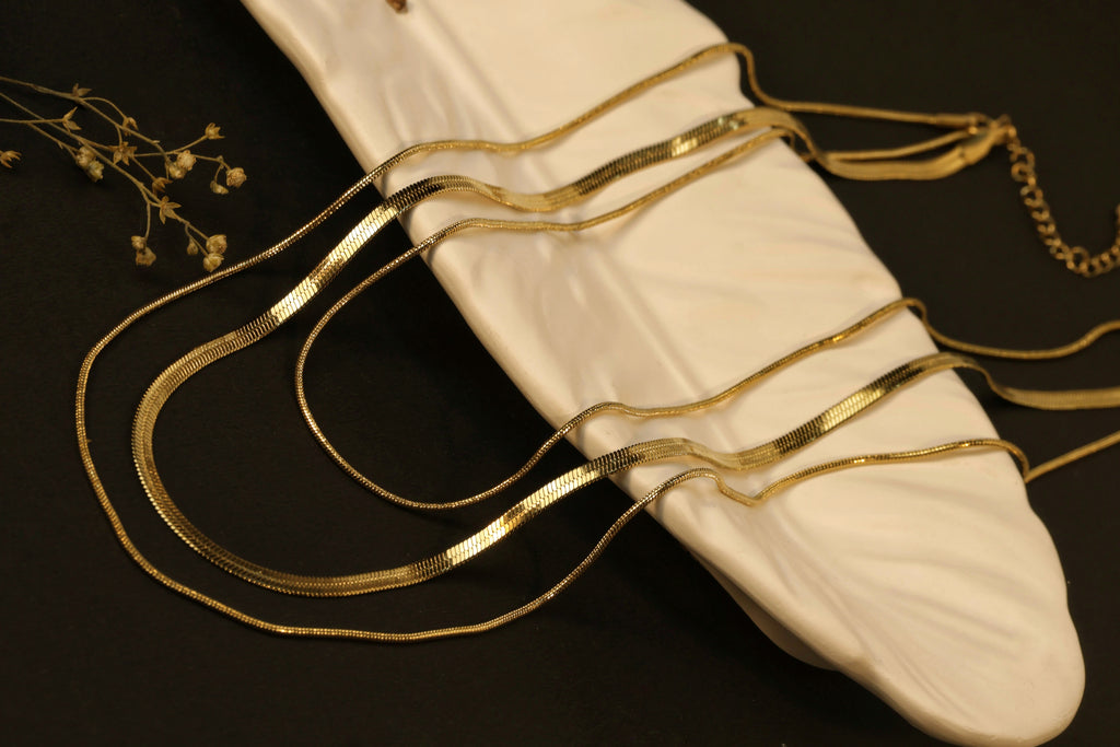 Liquid Gold Trio - three smooth, reflective gold bands.