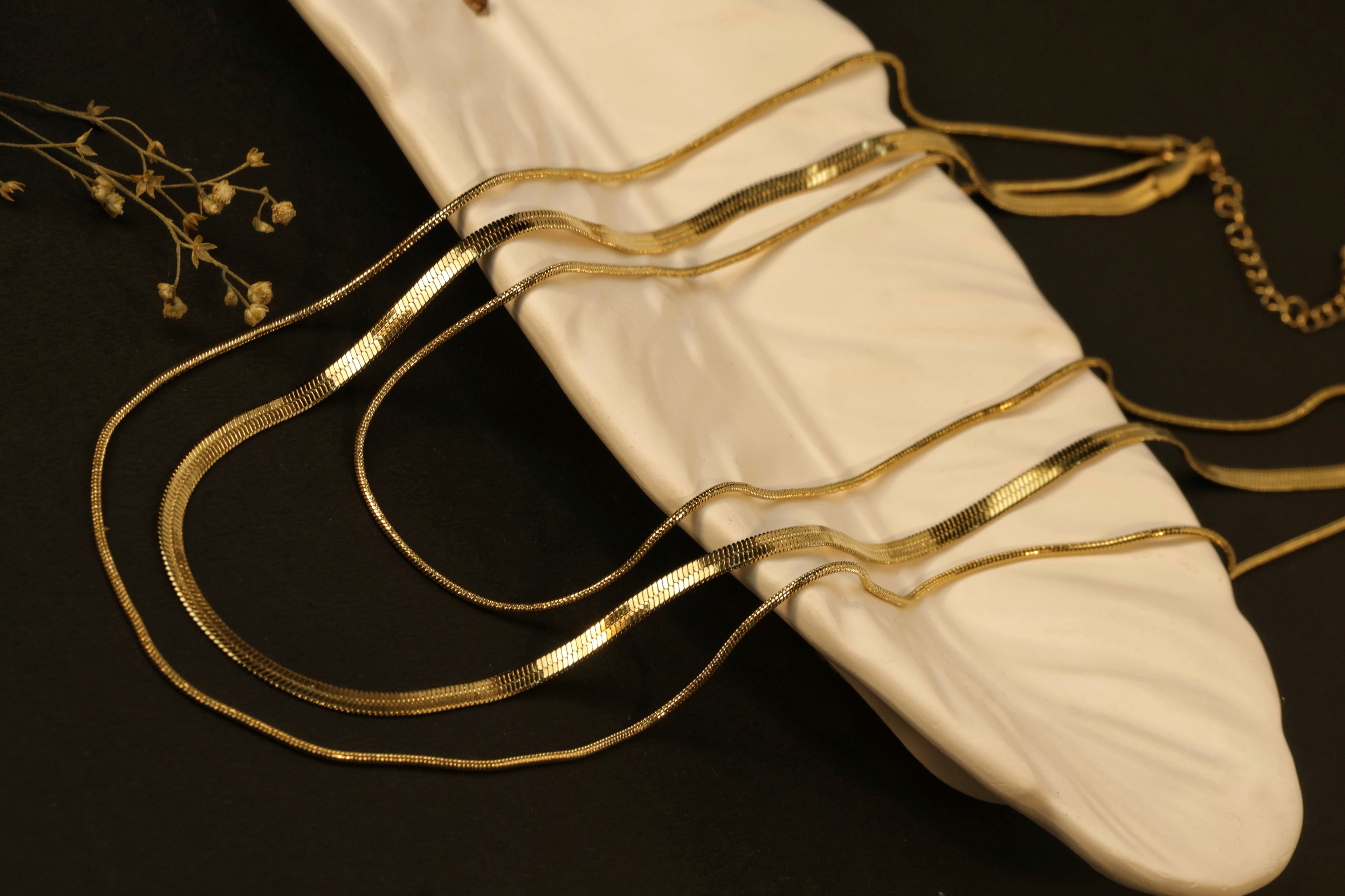 Liquid Gold Trio - three smooth, reflective gold bands.